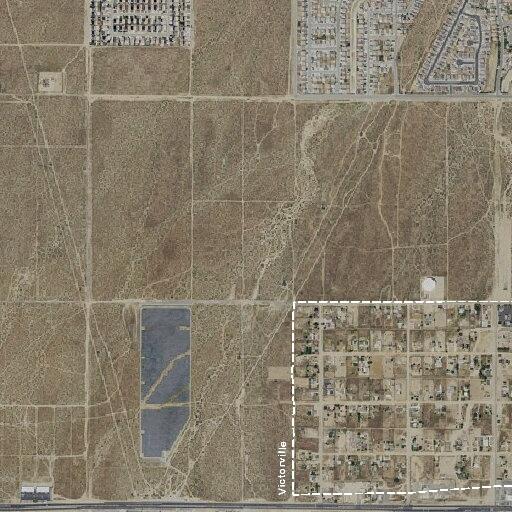 Burned vehicle or encampment reported in Victorville