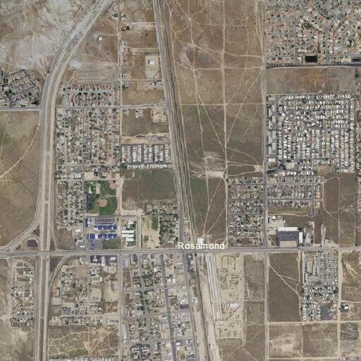 Man sleeping on couch near shed in Rosamond