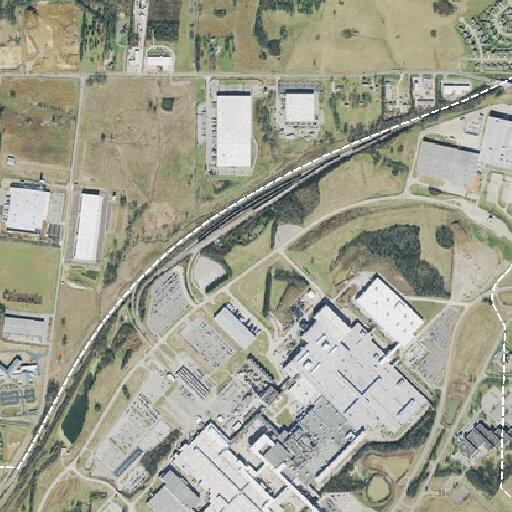Car hits pole at GM facility, minor damage