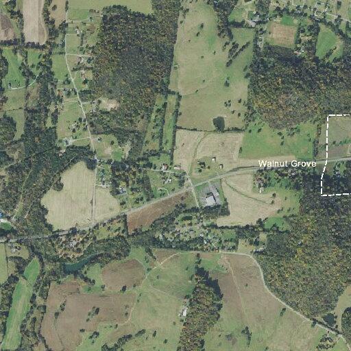 Car drives through field off Highway 25 West