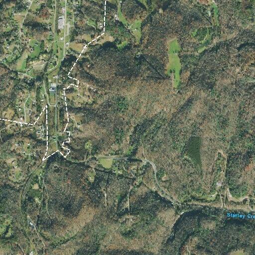 Burned vehicle blocking Paint Rock Road