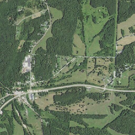 Speeding gray Jeep with flashers on near Macks Creek