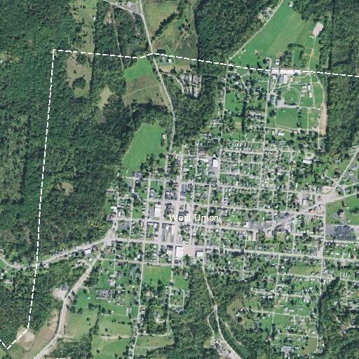 Suspicious woman lying on towel near vehicle in West Union