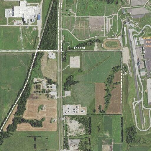 Grass fire spreading north near Topeka Boulevard