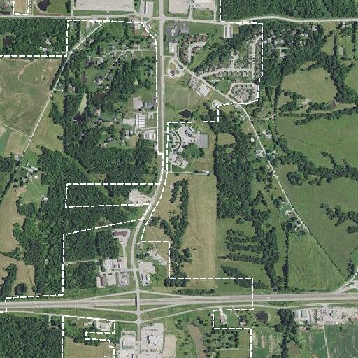 Pedestrian walking near city limits toward motel