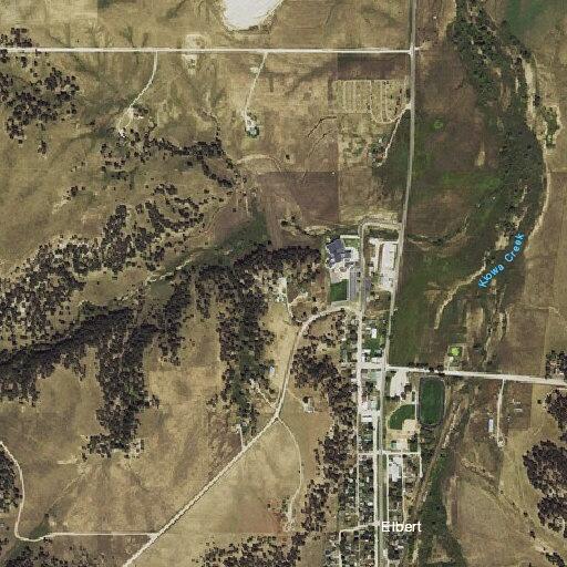 Person experiencing panic attack on Main Street in Elbert