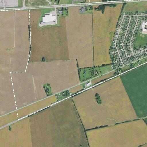 Suspicious pickup truck behind rural barn