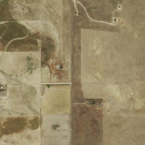 Male speaking with people in yard on Highway 71