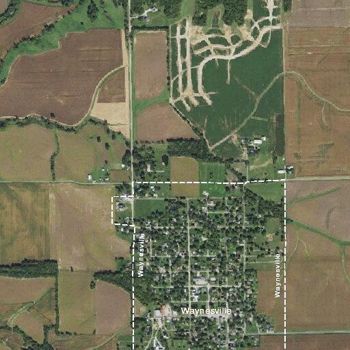 Unattended brush fire near railroad tracks in field