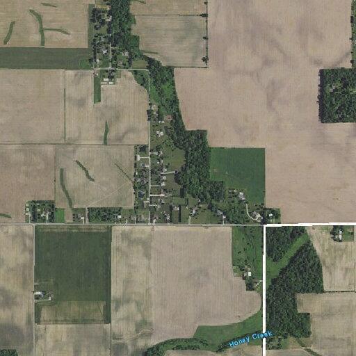 Dump truck overturns on rural road carrying gravel