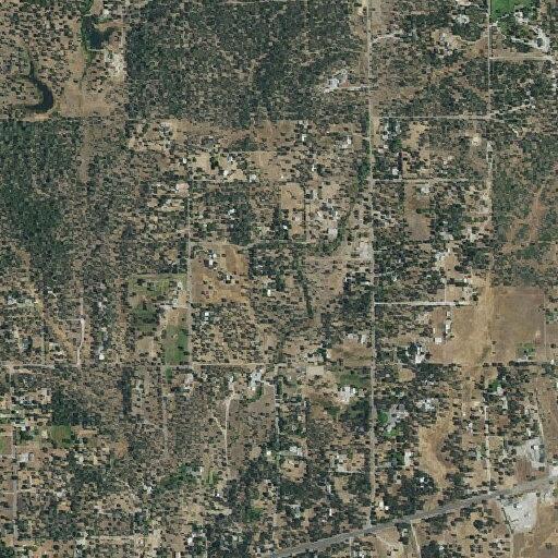 Report of a residence fire on Encanto in Bella Vista, spreading to vegetation; units responding and checking for possible evacuations.