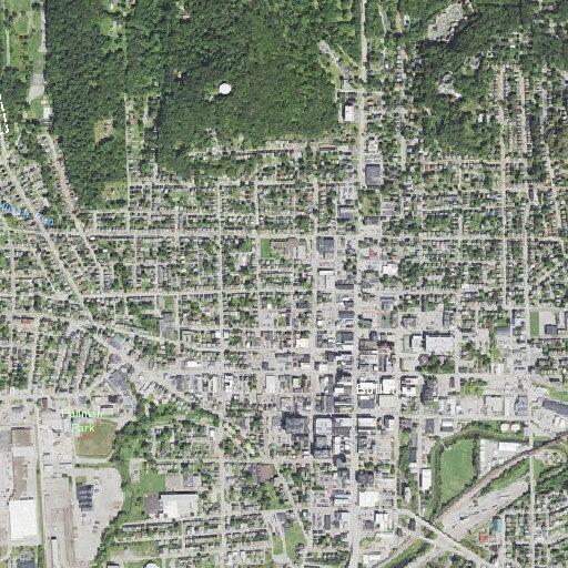 Woman with back pain in parking lot near West North Street