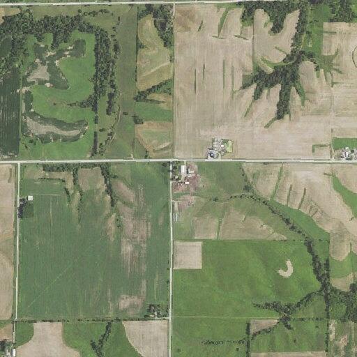 Grass fire near driveway spreading into fields