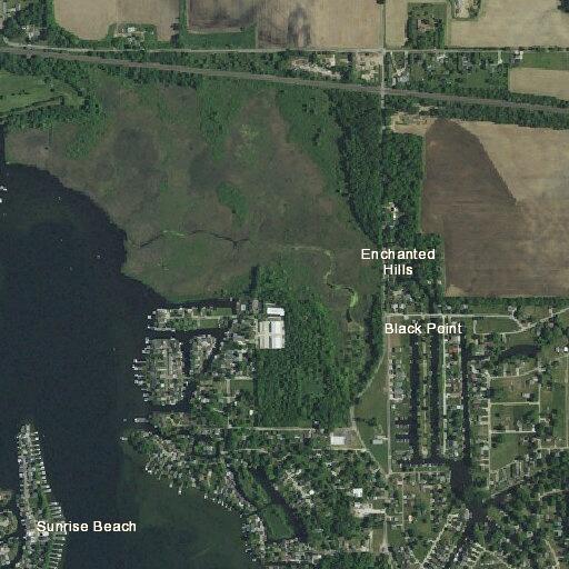 Grass and tree fire near vacant home in Syracuse
