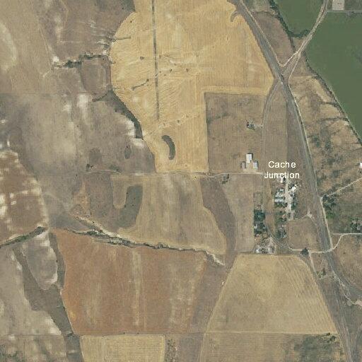 Large hay bales blocking road near Cache Junction