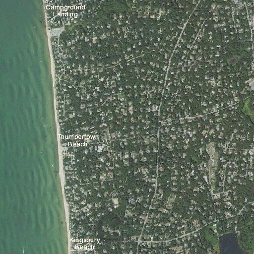 Person experiencing abdominal pain near beach road