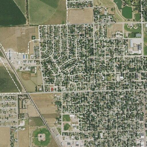Man looking into parked cars near Platte Avenue