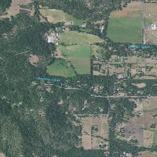 Tractor operating in dry grass near Williams Highway