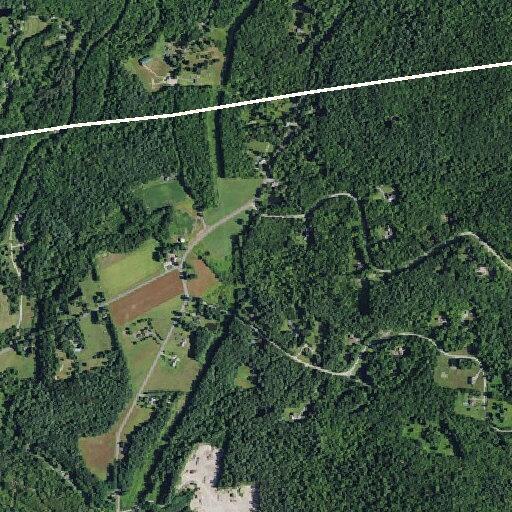 Broken utility pole with smoking wires in roadway