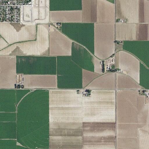 Vehicle spraying roadway near rural address