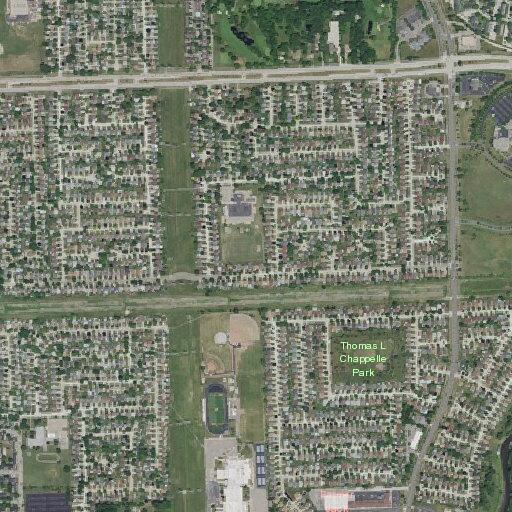 Speeding blue Honda sedan in subdivision