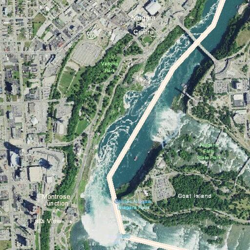 Woman possibly on edge of falls at Niagara in red jacket