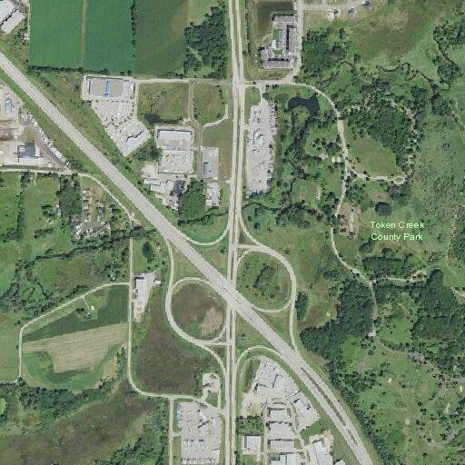 Car hits deer on highway shoulder