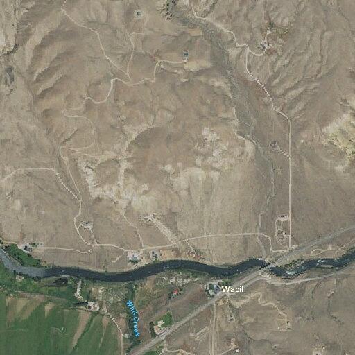 Vehicles parked off road near Wapiti for a week