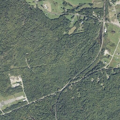 Rubber debris reported on railroad track near road