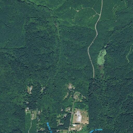 Brush fire near Beaver Lake threatens nearby home