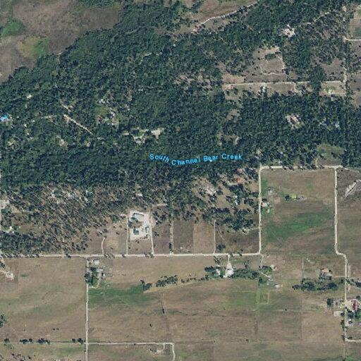 Grass fire near house on Middle Bear Creek Road