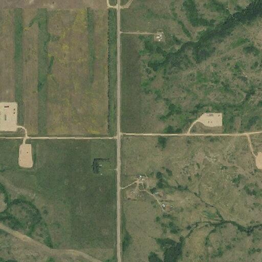 Hay bales on fire spreading to grass near Highway 22