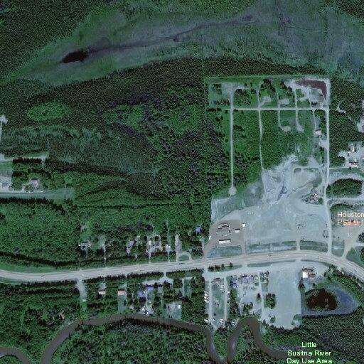Large wildfire in trees behind Miller's Market
