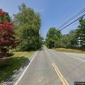 Tree resting on power lines, no hazard reported