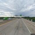 Stalled vehicle blocking highway ramp near bridge