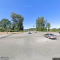 Disabled vehicle partially blocking highway lane
