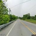 Tree leaning on power lines along Route 183