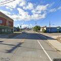 Tractor trailer blocks Main Street while turning