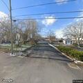 Two-car crash with fluid leak blocking roadway