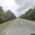 Pedestrian walking in breakdown lane on I-195