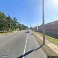 Person complaining of head pain at road intersection