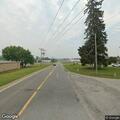 Car and motorcycle crash blocking roadway