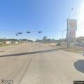 Officer stops gray pickup at gas station