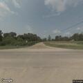 Man walking in roadway, gesturing at drivers