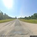Officer assists side-by-side vehicle on rural road