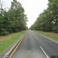 Person standing in roadway on Northern State Parkway