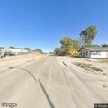 Younger male passed out on sidewalk near highway intersection