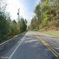 Tree down with electrical hazard blocking roadway