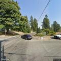 Person wandering and lying in yard at SE 152nd St
