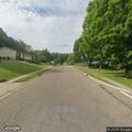 Officer checks car with open trunk on Nadine Lane